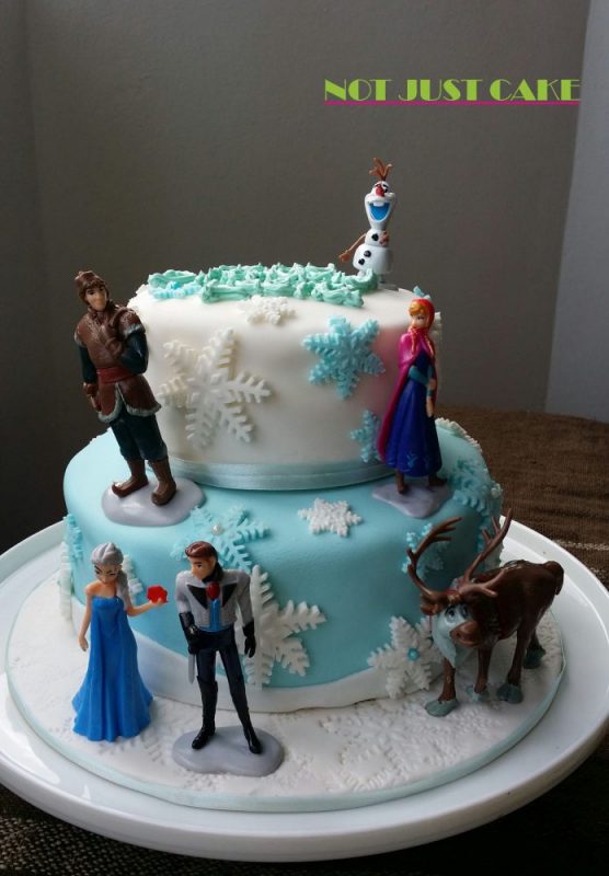 Two tier frozen cake with toppers