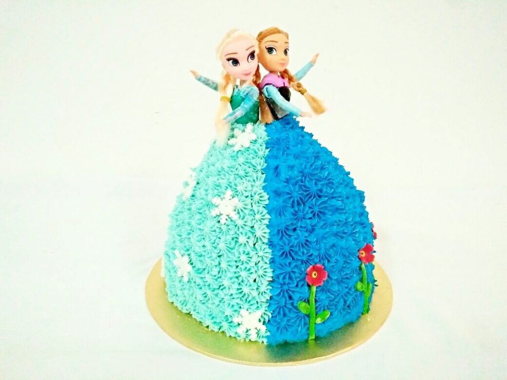 Elsa and Anna doll cake. By Eats and Treats. Source