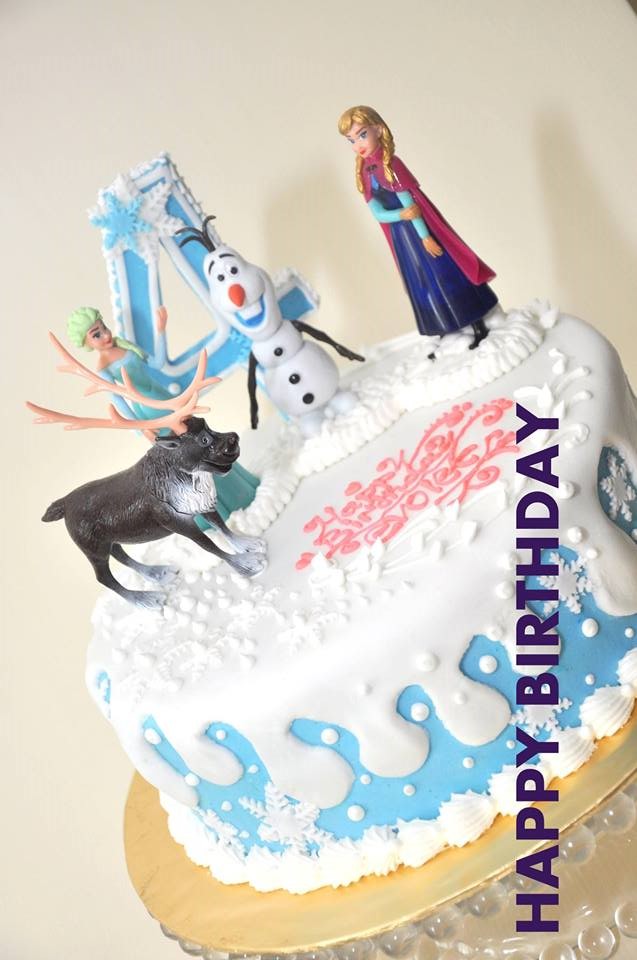 Drip cake with Frozen toppers. By Big Boys Oven. Source