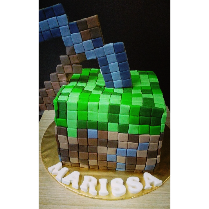 Pickaxe and grass block combination Minecraft cake by Pink Palette