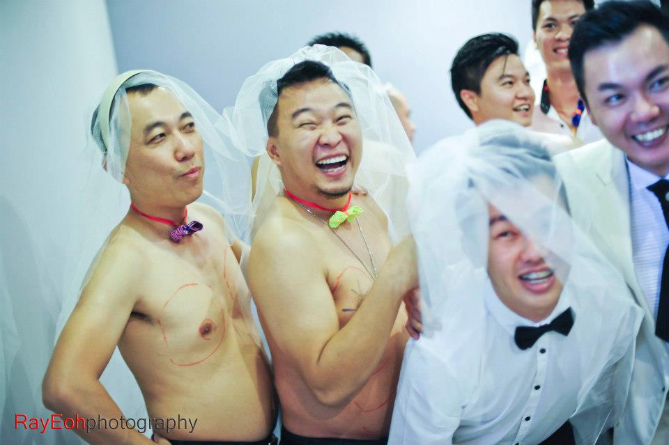 Just before the plastic surgery session. Wedding gatecrashing games photo by Ray Eoh Photography