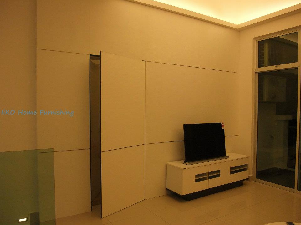 Hidden Door in the living room by IIKO Concept. Source. 