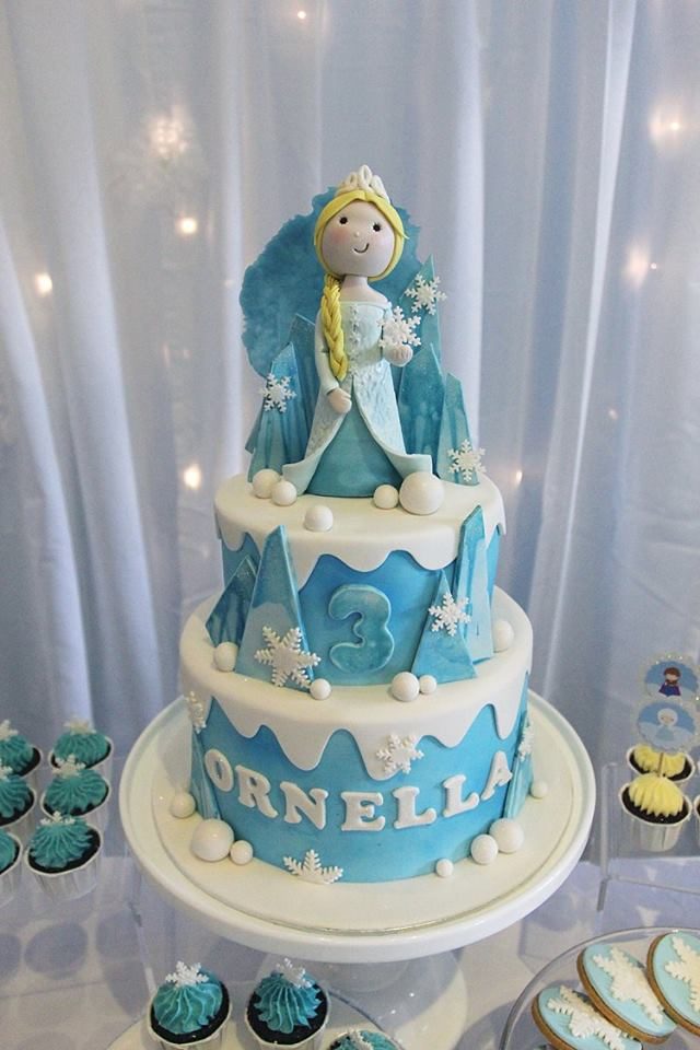 Two-tier Frozen-themed cake with Elsa.Made by: Little House of Dreams. Order in Singapore at Recommend.sg