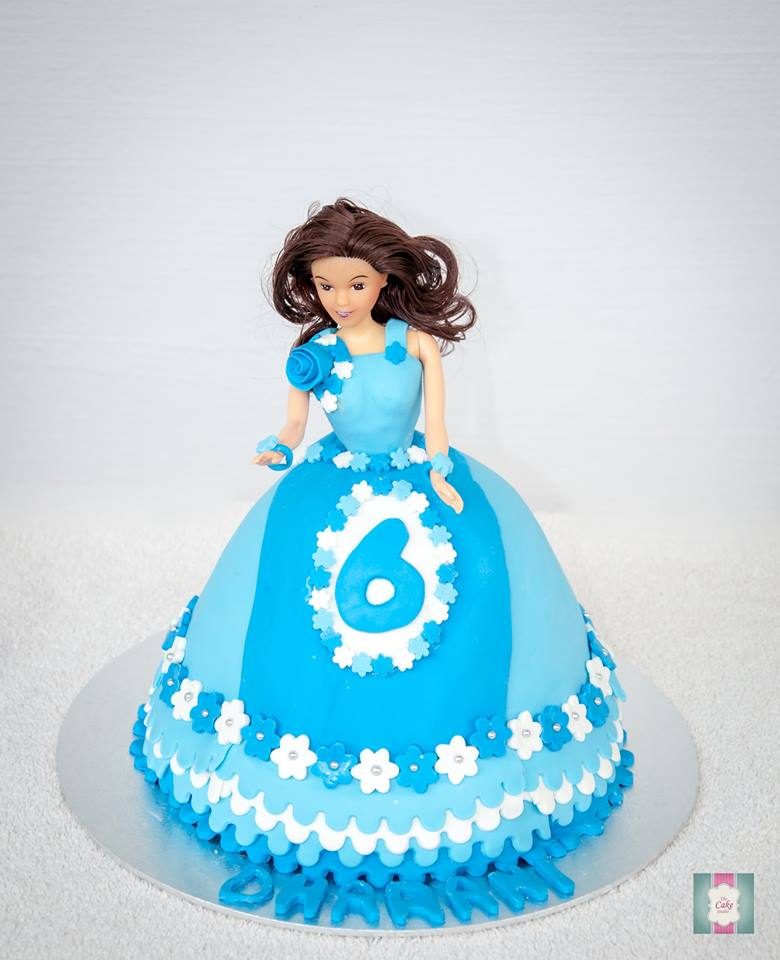 Doll cake with blue gown. Made by: The Cake Studio SG. Order in Singapore at Recommend.sg