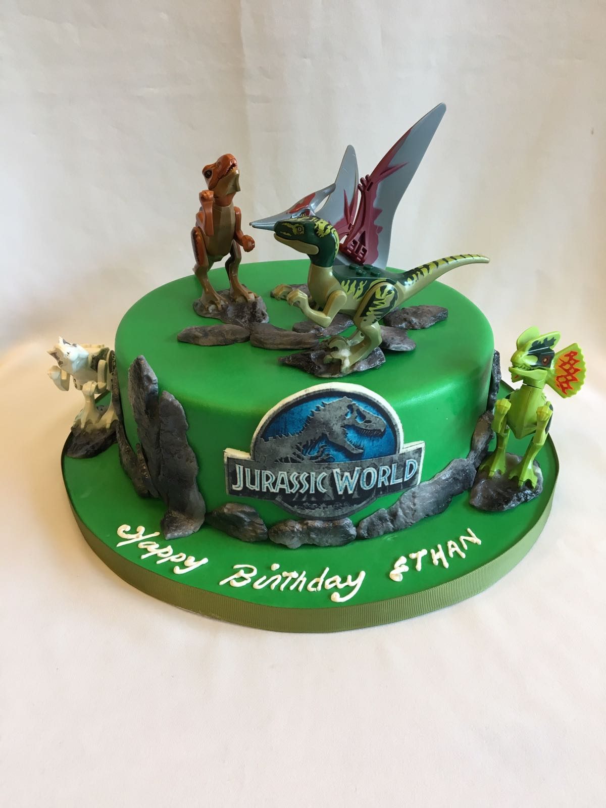 Jurassic World Themed Cake with Action Figure Lego Toppers by Temptations Cake