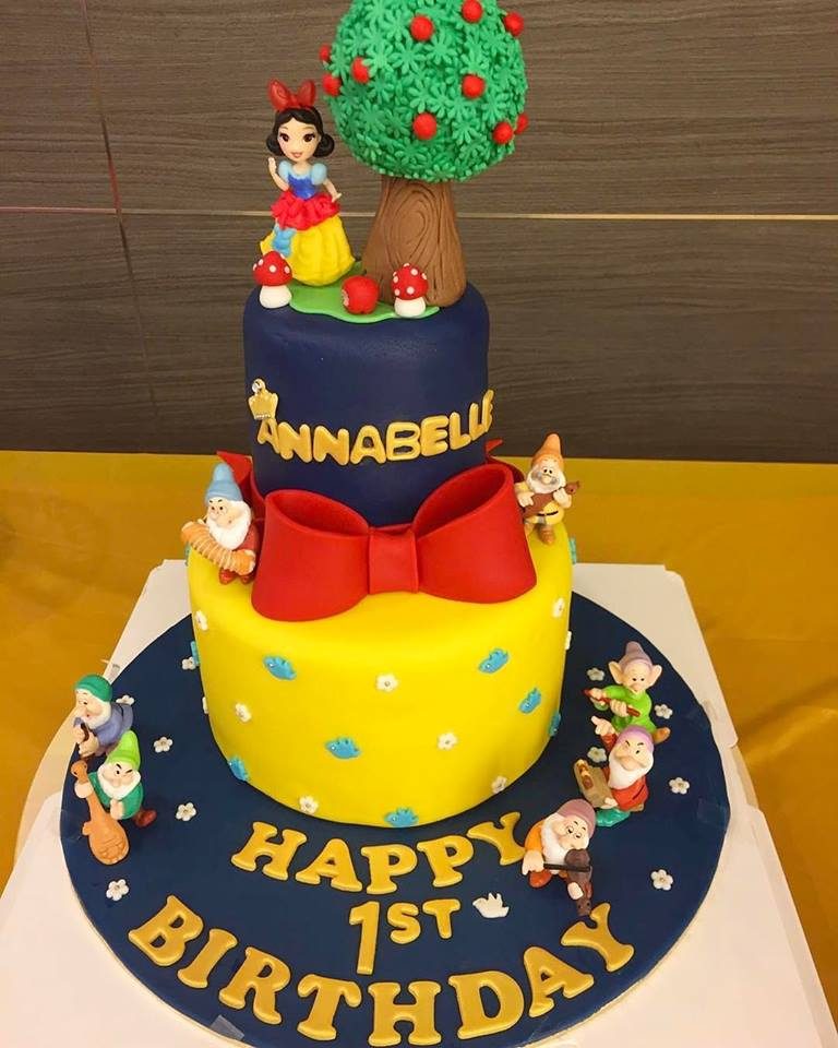 Snow White princess cake under the apple tree, with the seven dwarves playing musical instruments.Made by: Oni Cupcakes. Order in Singapore at Recommend.sg