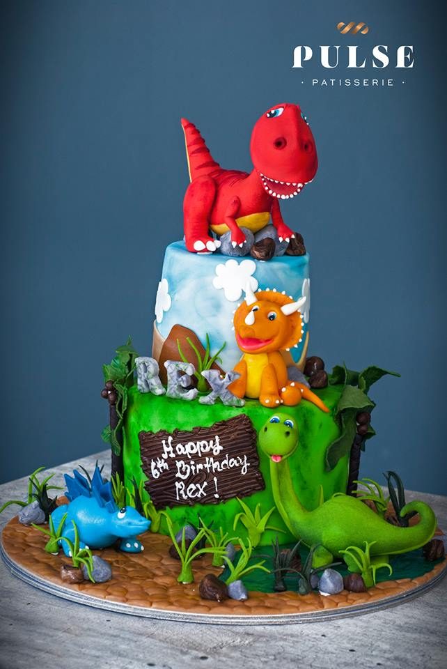 Two-tiered Dinosaur cake with jungle scene by Pulse Patisserie