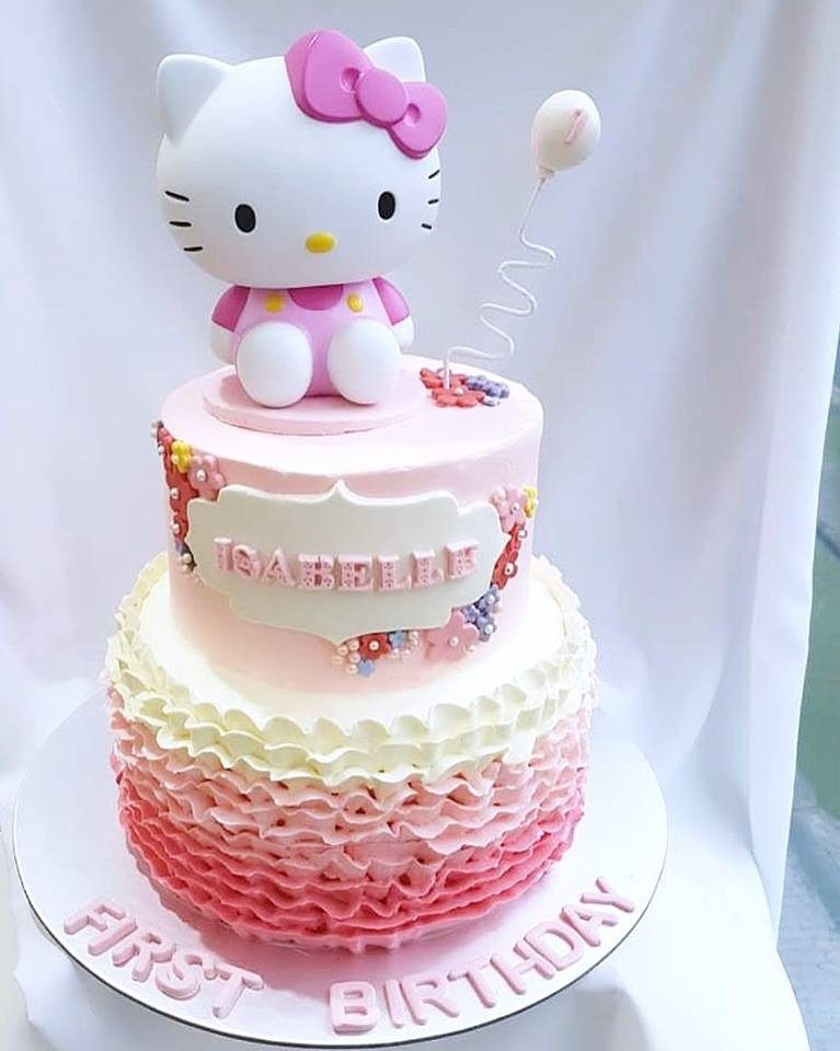 One big Hello Kitty Figure on top of a two-tiered cake. Made by: Corine and Cake. Source
