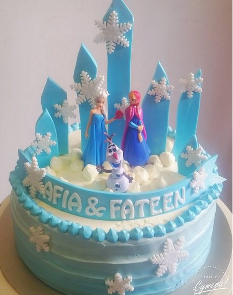 Ribbons, towers and snowflakes Frozen cake by BakedByIn