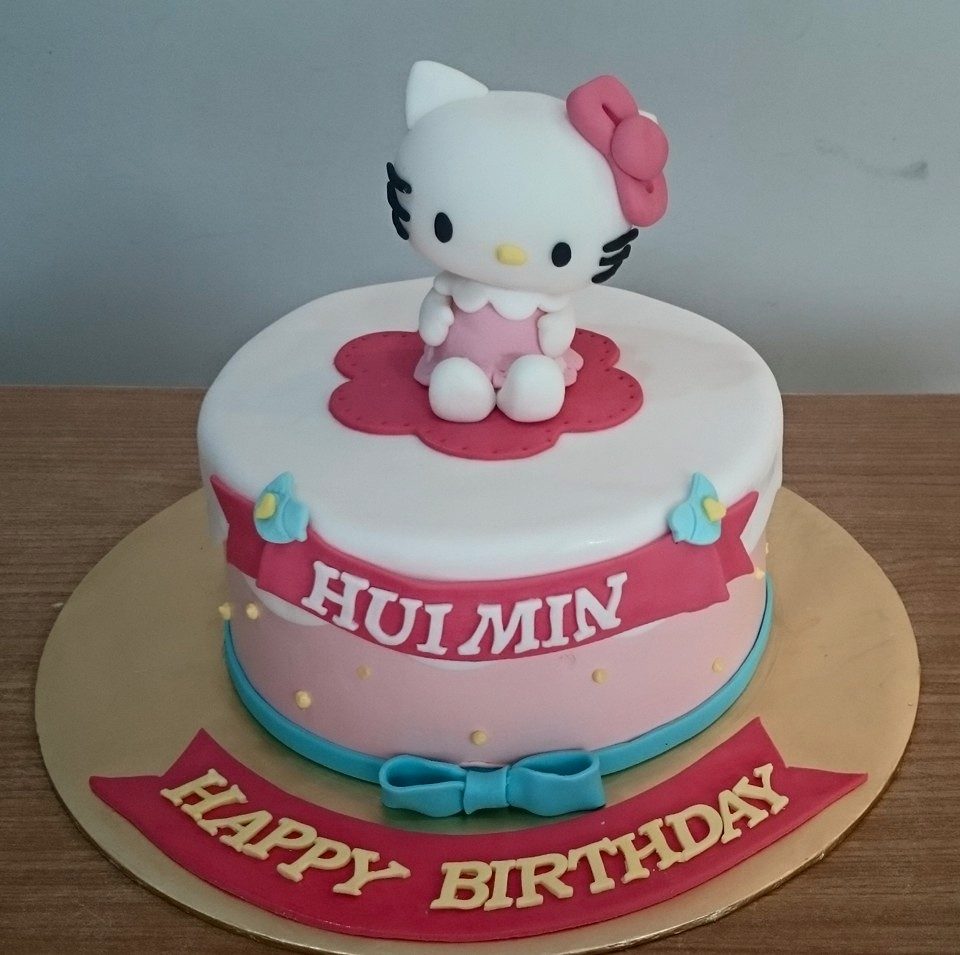 An edible 3D Hello Kitty figure made of fondant on a round cake nicely wrapped with fondant. Made by: My Fat Lady Cakes and Bakes. Source