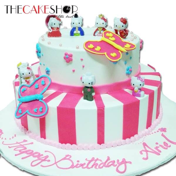 A pink and white cake with Hello Kitty figures. Made by: The Cake Shop SG. Source