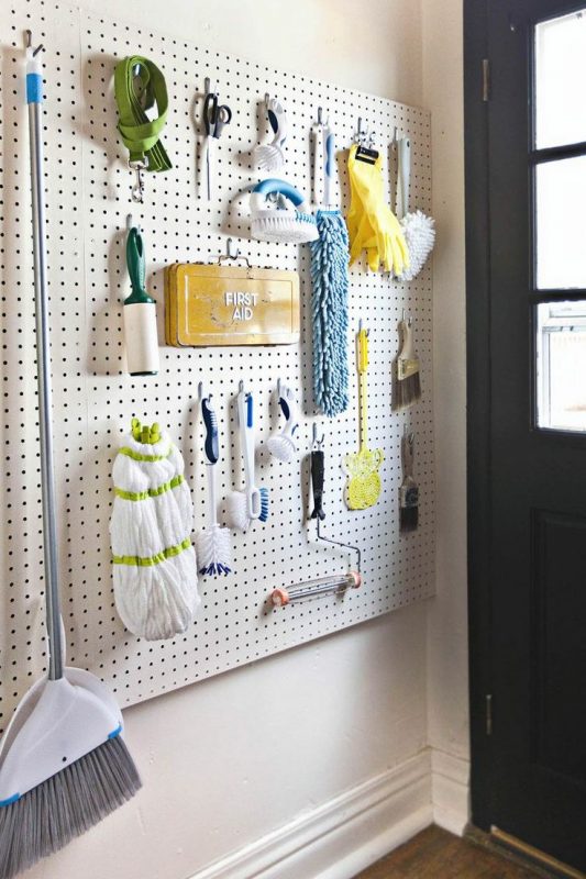 Install a pegboard on one wall to hang tools and make it a multipurpose space