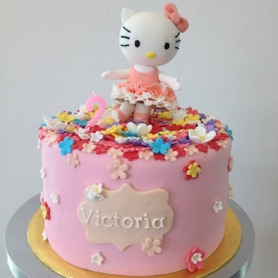 A round pink cake with a bunch of colourful flowers sprinkled on it, and a 3D Hello Kitty topper is perfect for your child’s 2nd birthday. Made by: Foret Blanc Patisserie.Source