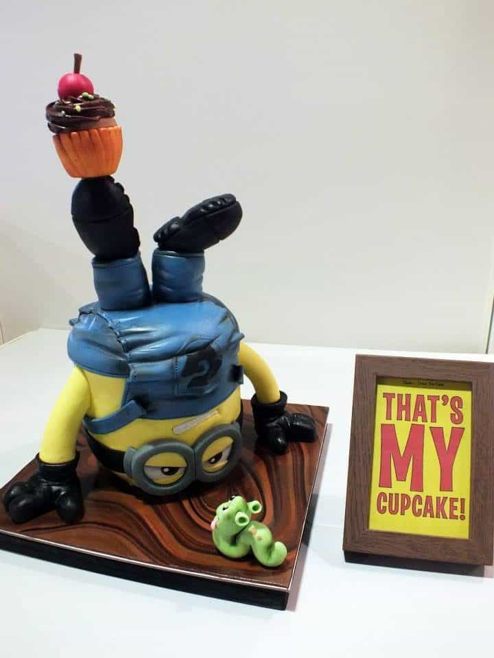 An upside down 3D Minion cake made of gum paste and fondant is just too creative!. Made by: The White Ombre.Source