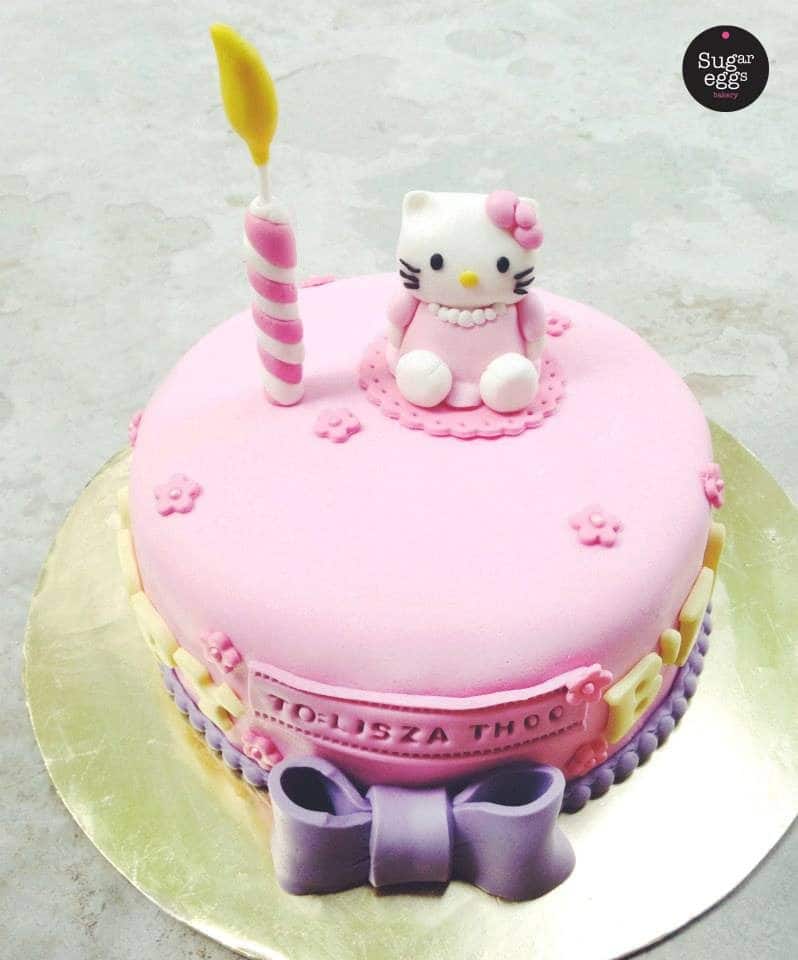 A low, one-tiered round cake is perfect for birthday with a artificial candle and a little Hello Kitty topper.Made by: Sugareggsbakery.Source