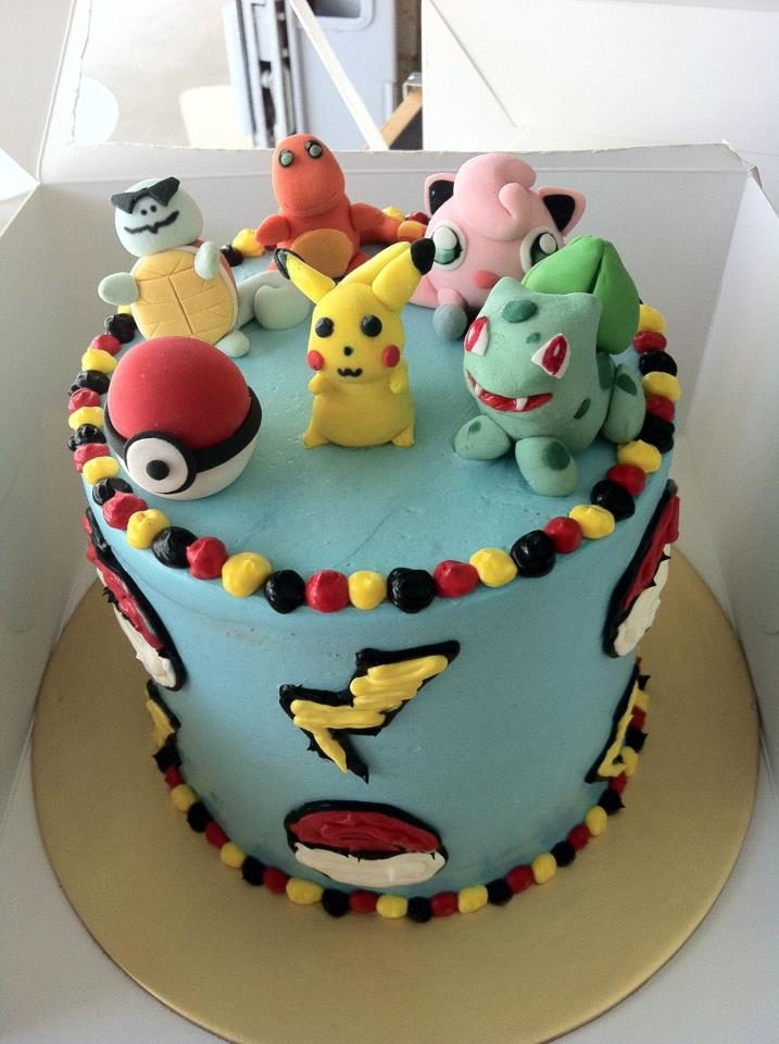 A tall round cake with buttercream frosting and 3D Pokemon characters made of fondant. Custom cake by My Fat Lady Cakes and Bakes.Source
