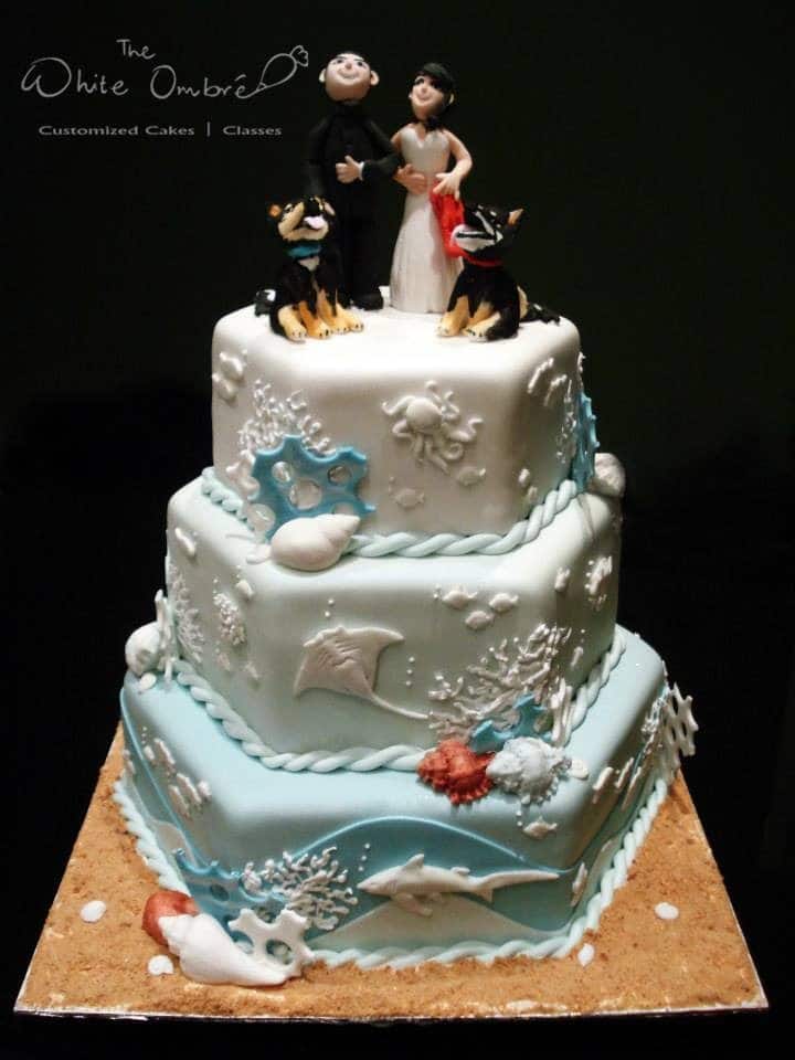A unique three-tiered hexagon shaped cake with under-the-sea themed detailings. Made by: The White Ombre.Source