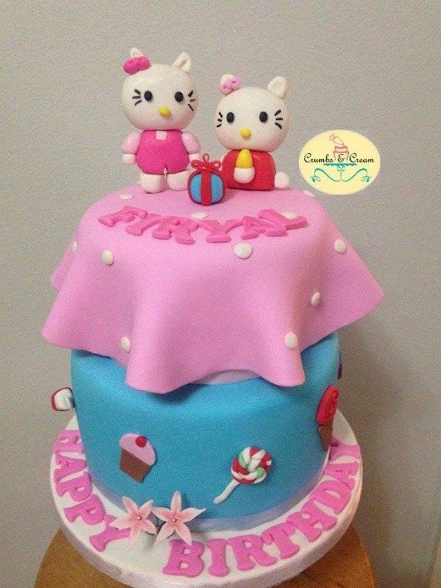 This two-tiered cake with a unique, flared fondant icing and medium-sized Hello Kitty toppers will make the best centrepiece for your party. Made by: Crumbs & Cream.Source