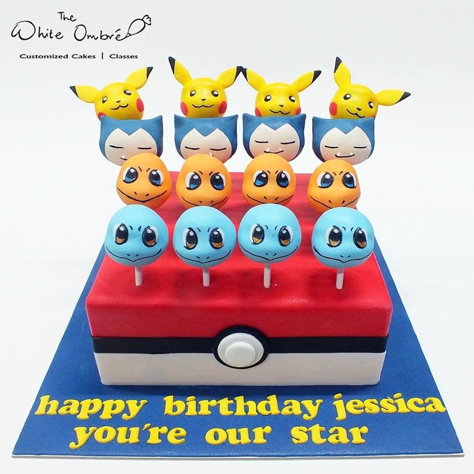A two-in-one centrepiece with a square cake with Pokeball design as base and cake pops with Pokemon characters as the topper means more share for everyone!. Custom cake by The White Ombré . Source