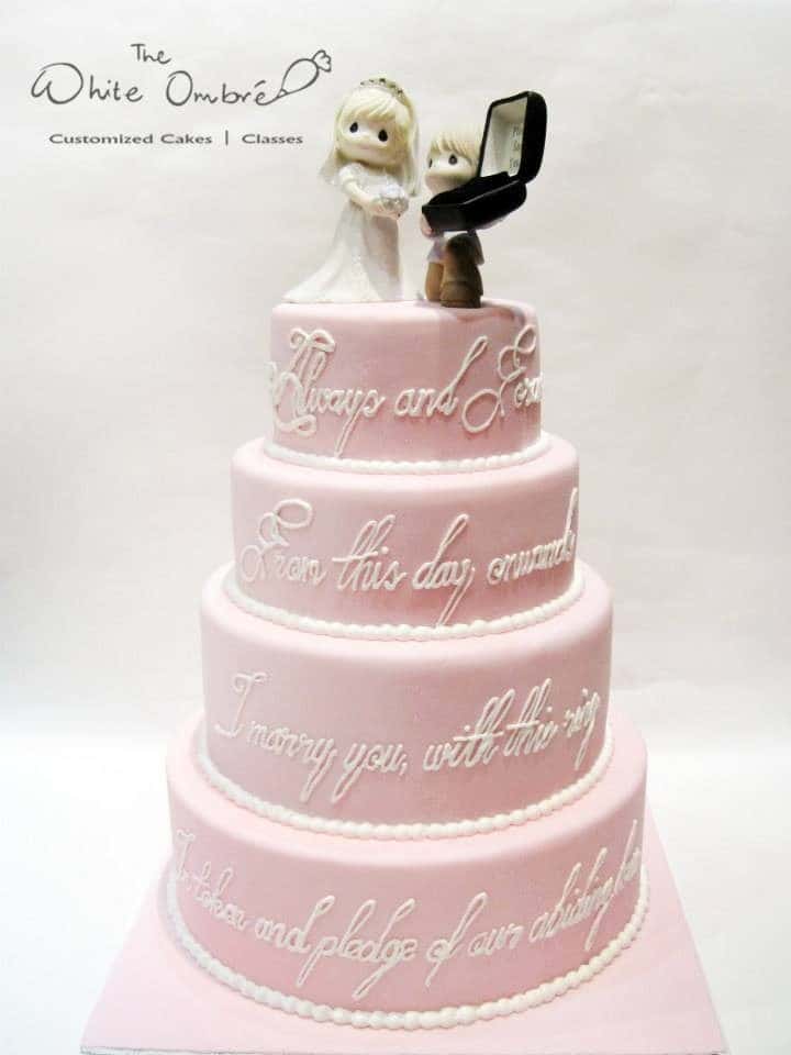 A hopelessly romantic wedding cake with wedding vows written on side of the cake is just perfect. Made by: The White Ombre.Source