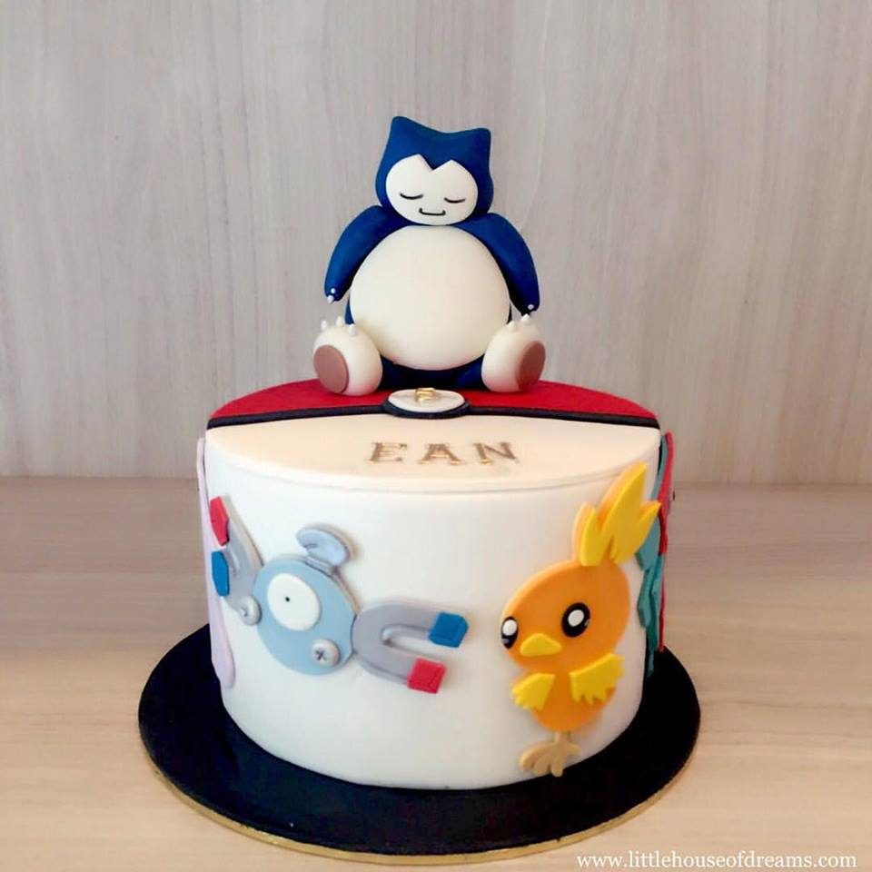 Adorable Snorlax figurine on top of a cake decorated with fondant cutouts of Pokemon characters. Custom cake by Little House of Dreams.Source
