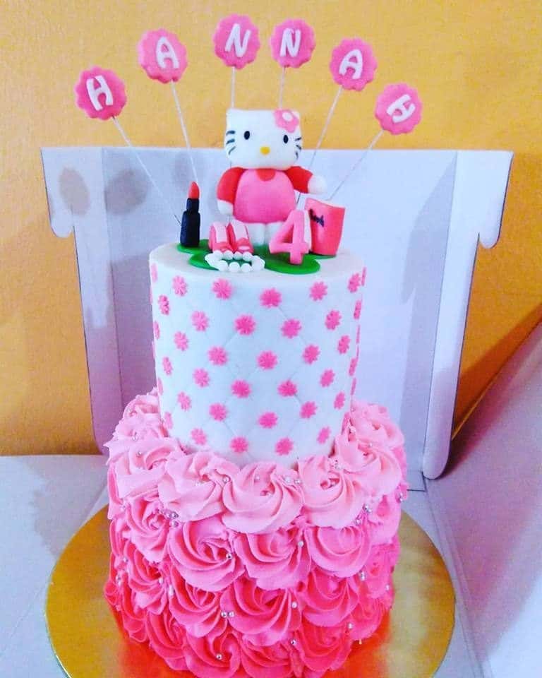 A beautiful, tall, round-shaped cake with huge rosy icing beneath looks even more complete with a 3D Hello Kitty topper, and few stick toppers to write your kids’ name. Made by: Suez Cakes. Source