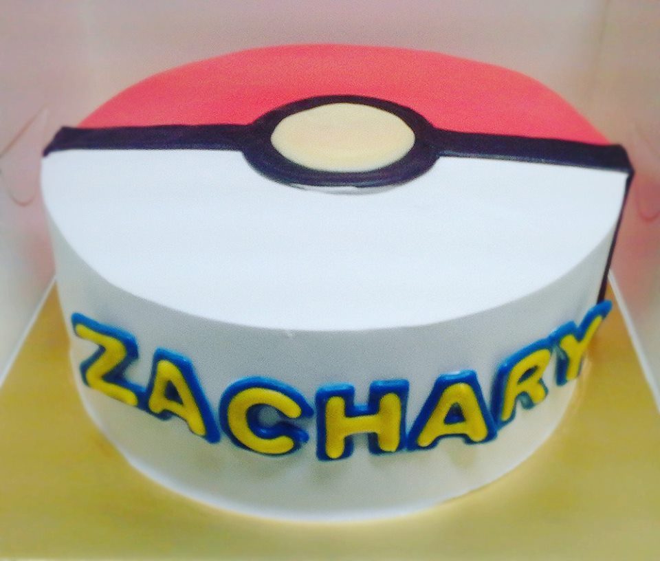 A regular round Pokemon cake turned into a Pokeball with white, red and black buttercream. Custom cake by Naomi Kitchen.Source