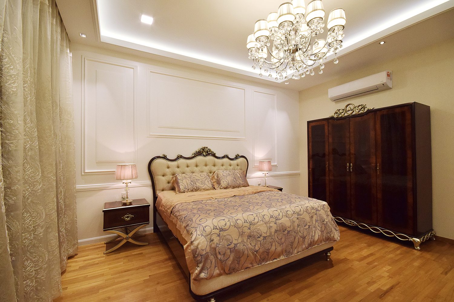 Victorian-inspired bedroom with ornate furniture and heavy drapery for this bungalow in Kajang Jade Hill