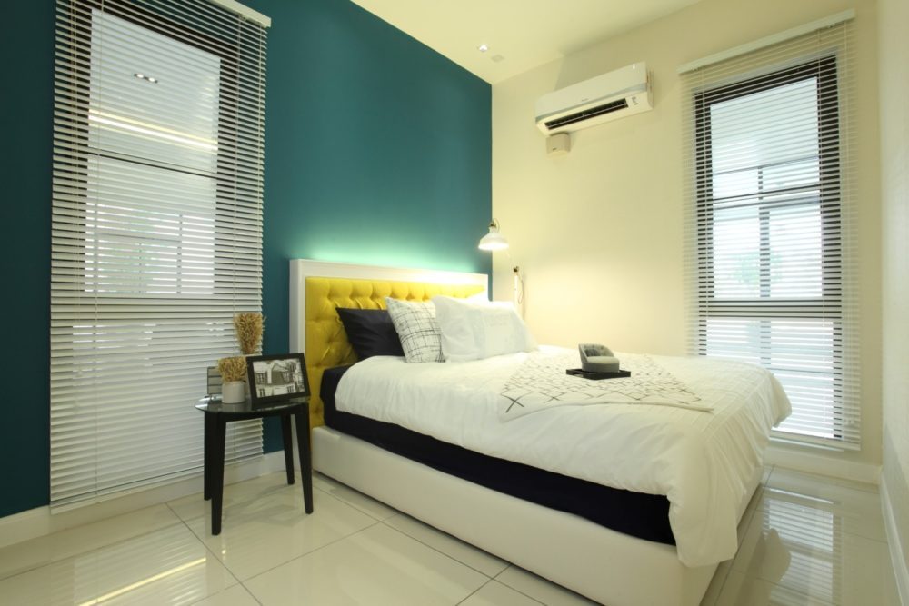 Simple bedroom design with turquoise accent wall and backlit headboard in Setia Eco Glades, Cyberjaya