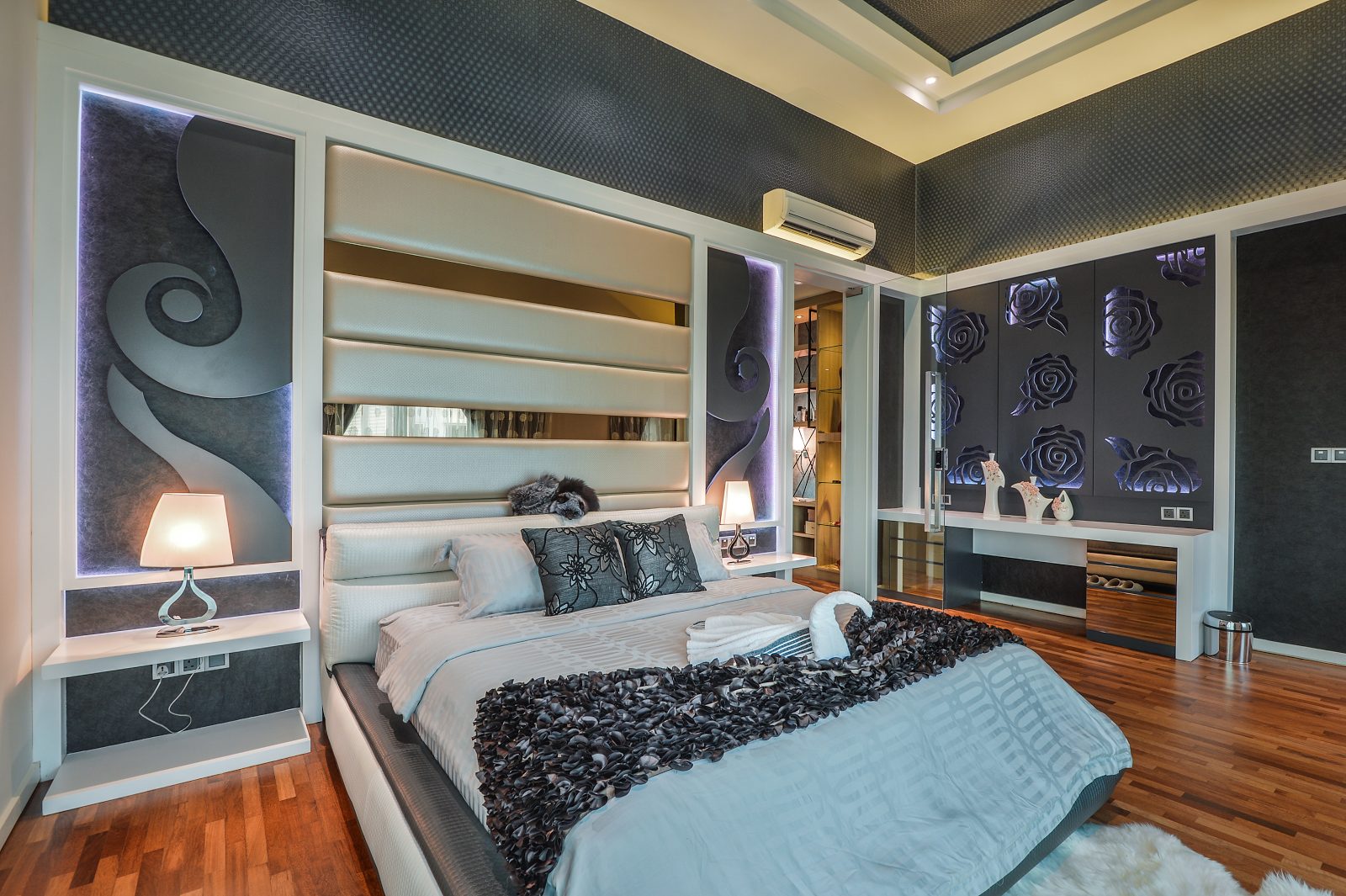 Modern bedroom with floral accents in this semi-detached house in Cheras, Kuala Lumpur