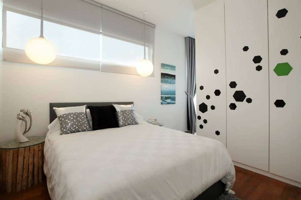 Modern contemporary bedroom with hexagon accents on the wardrobe for this condominium in Puchong