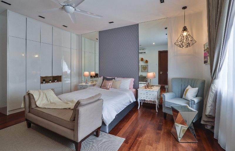 Textured wallpaper and symmetrical mirrors to balance this bedroom in Subang Bestari, Subang