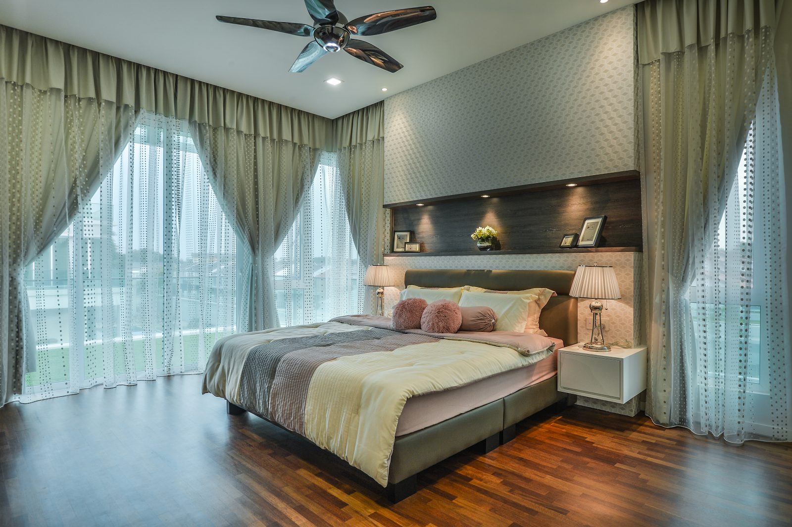 Heavy drapery and feature wall creates a cosy bedroom design in Cheras, Kuala Lumpur